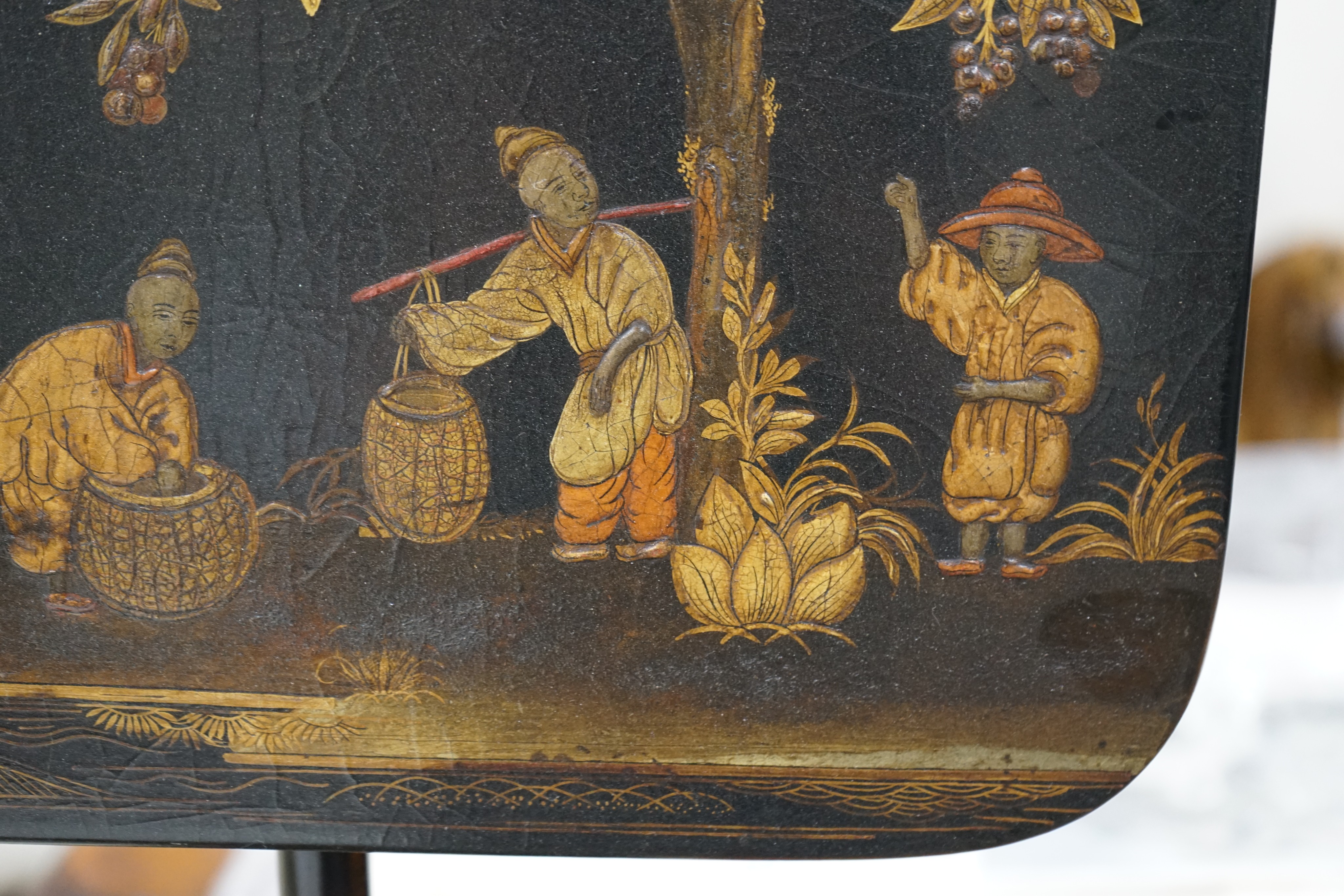 A pair of 19th century chinoiserie lacquer pole screens, height 152cm